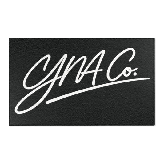 Signature Script Area Rug — Black "YNA Co." Doormat-Style Accent Rug